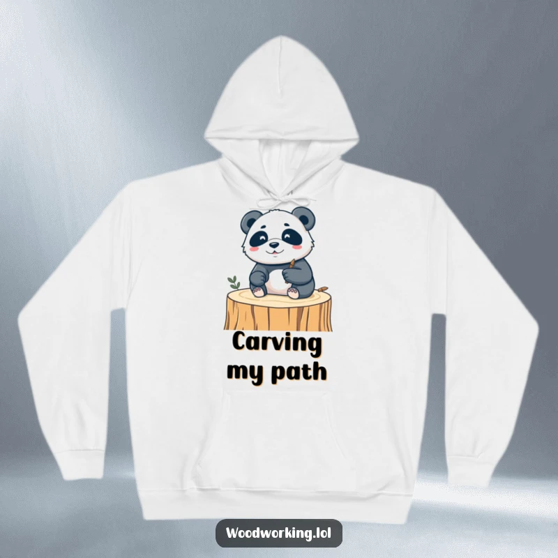 Funny hoodie featuring a silly panda engrossed in carving a delicate design into a piece of wood, embodying focused artistry.