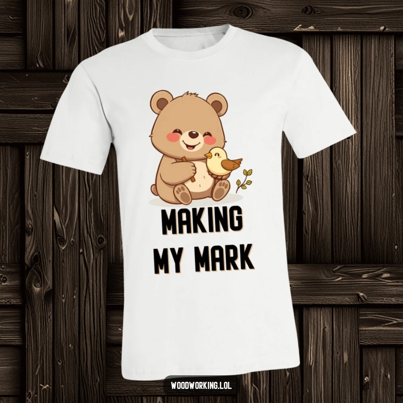 Funny bear giggling and proudly carving a small wooden bird, printed on this comfortable t-shirt.